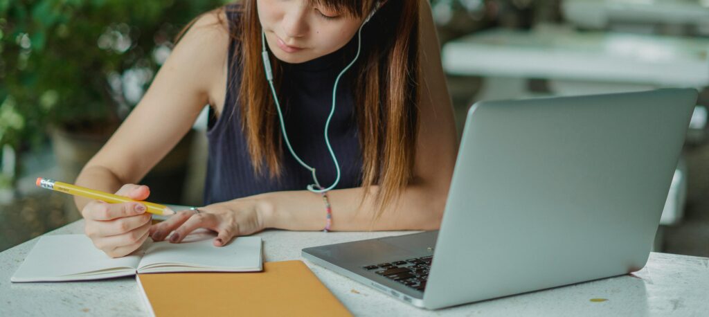 a female College Student Taking Notes