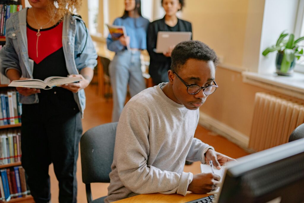 College students in the Library to pick books