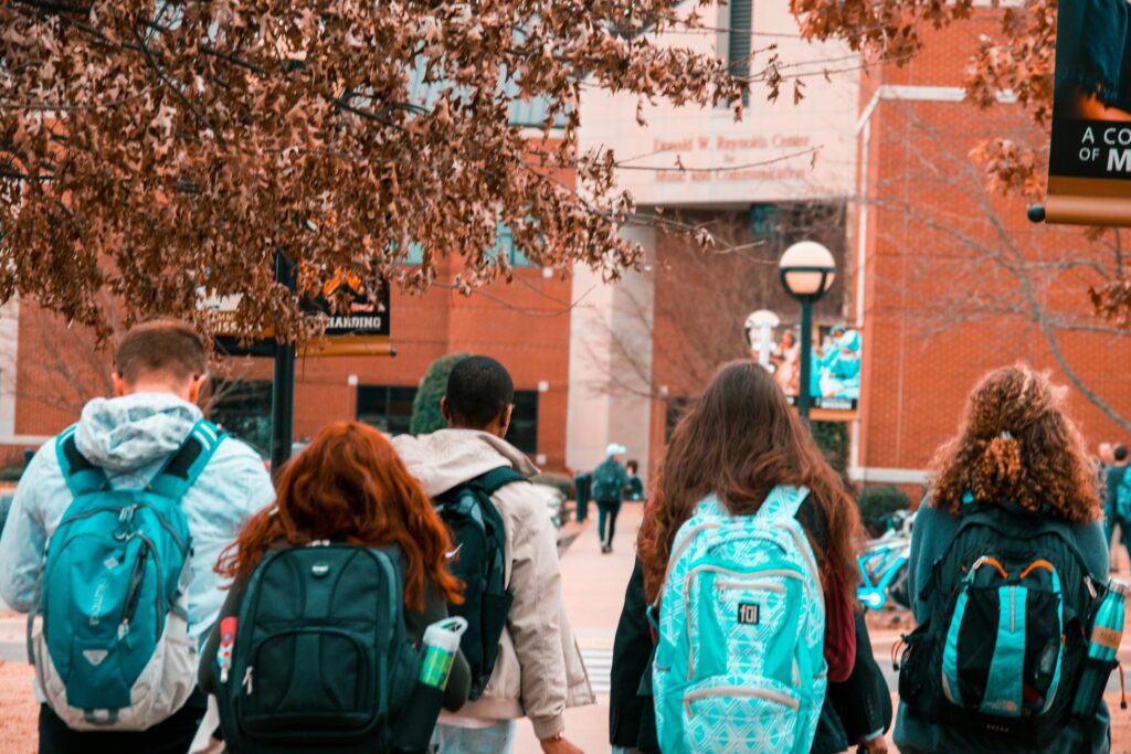 Group of students on backpack going to school