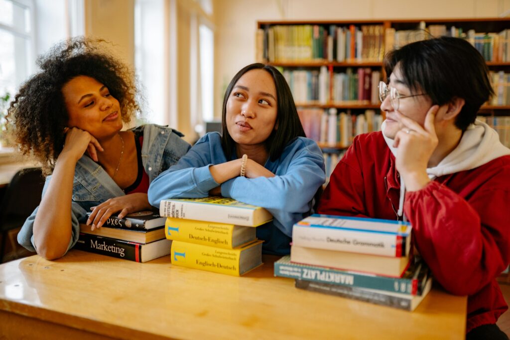 Close-Up Shot of Three students in the Library